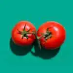 two tomatoes ready to be diced