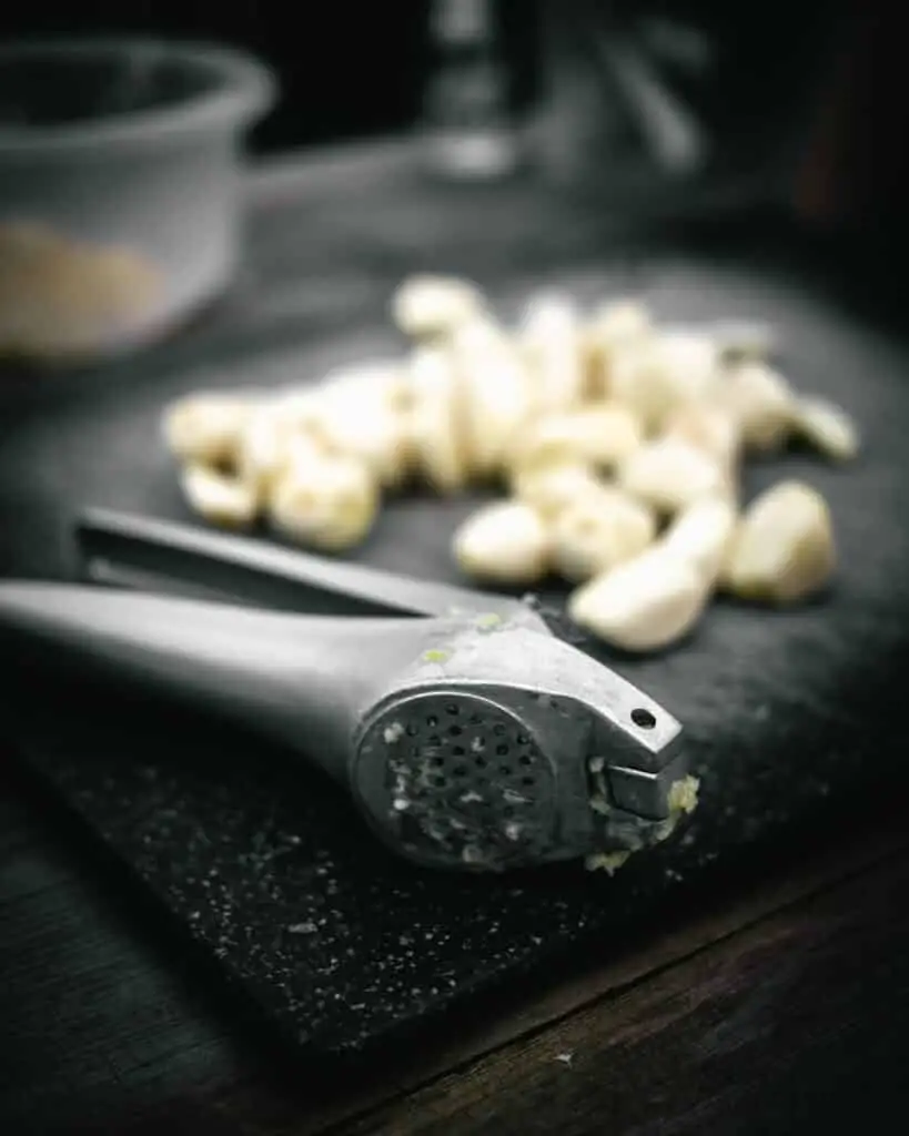A garlic press for use when learning how to mince ginger