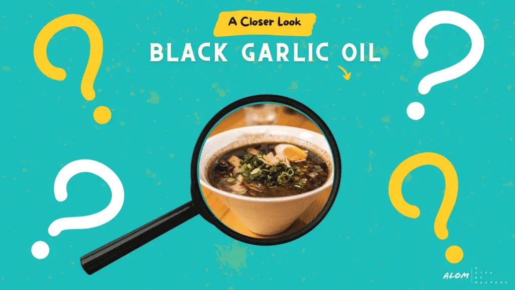 A magnified photograph of ramen topped with black garlic oil